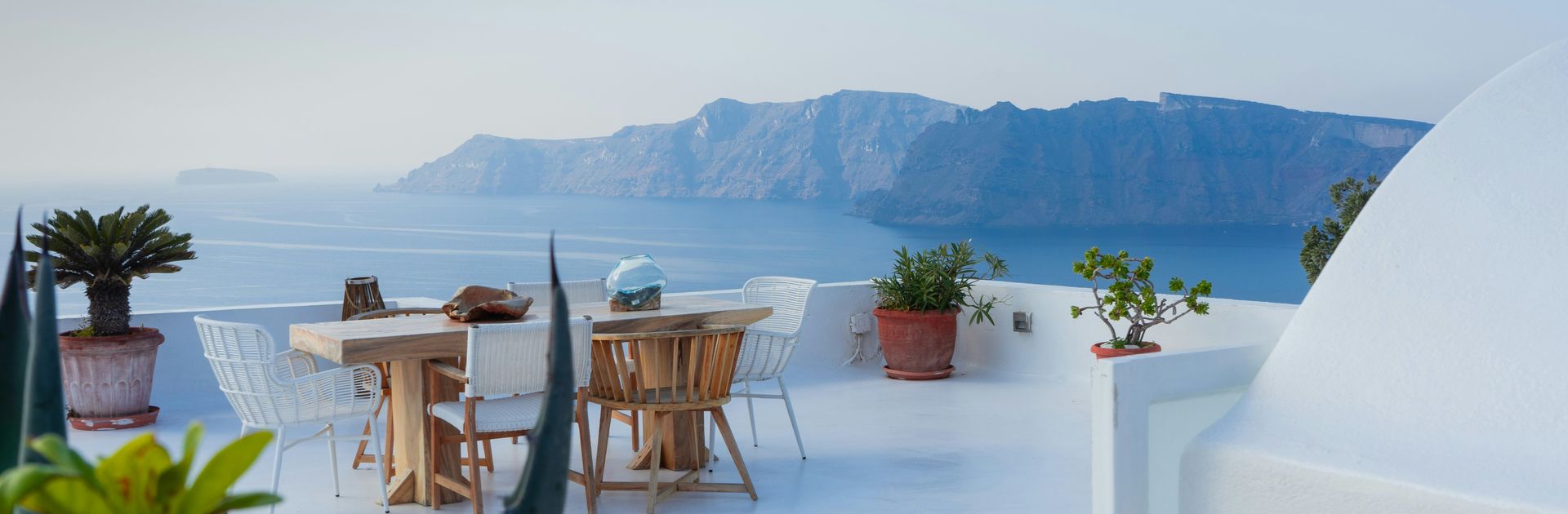 A terrace dining table overlooking the sea