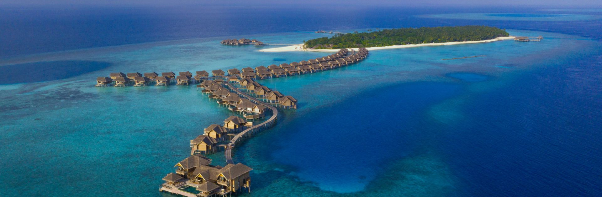 Vakkaru Maldives from the air — the island and its over-water villas