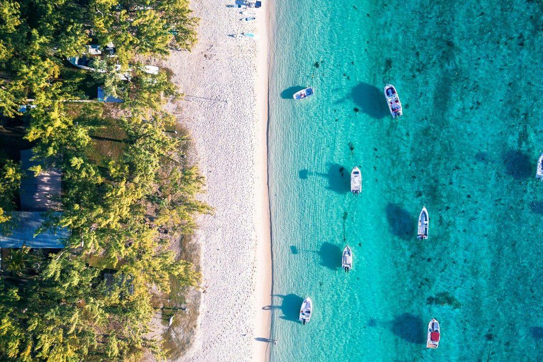 A beach and shallow water seen from the air